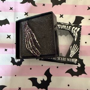 Kreepsville Skeleton Hand Brooch in Black and Purple